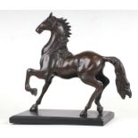 A brass / bronze figure of a horse. 27cm high