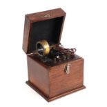 A vintage crystal radio set with Seaford coil, in an oak case.