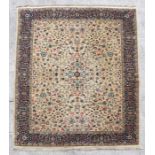 A large Indo Persian floor rug decorated flowers within a multi border, 3m by 4m.