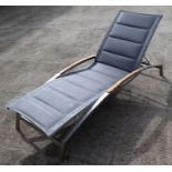 An Indian Ocean design Plaza stainless steel and teak lounger.