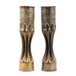 A matching pair of WW1 trench art fluted shell cases inscribed with foliage. 34cms (13.375ins) by