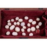 A collection of twenty five Grand Tour plaster intaglios in a mahogany case.