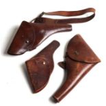 Three leather gun holsters (3).