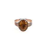 A Georgian unmarked gold (tested 9ct) foil backed citrine ring, approx UK size 'J'.