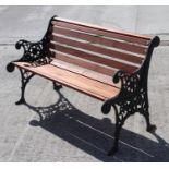 A garden bench with teak slats and cast iron ends,119cm wide.Condition Reportsome of the seat