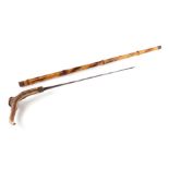 A bamboo shafted sword stick with a stag horn handle and having a 49cms (19.25ins) square section