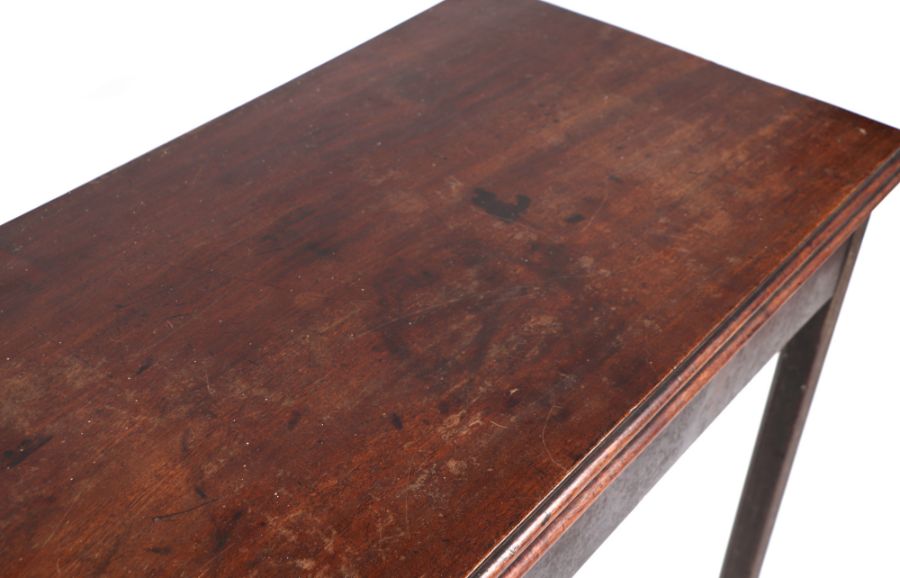 A Georgian mahogany tea table on square reeded chamfered legs, 91cms wide. - Image 2 of 3