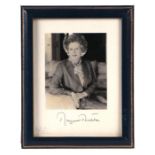 A facsimilie signed photograph of Lady Margaret Thatcher, image size 10 by 12cms, mounted in a