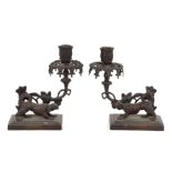 A pair of Regency style bronze candlesticks, 19cms high (2).