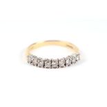 An 18ct gold seven stone diamond half-hoop ring, approx UK size 'N', 3g.