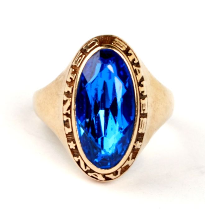 Naval interest: A 10ct gold United States Naval blue stone ring, approx UK size 'O', 8g.