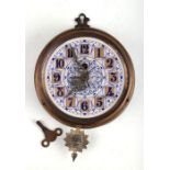 A continental brass wall clock, the painted dial with Arabic numerals, 20cms diameter.