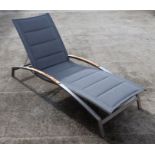 An Indian Ocean design Plaza stainless steel and teak lounger.