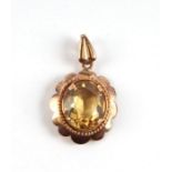 A 9ct gold citrine set pendant.