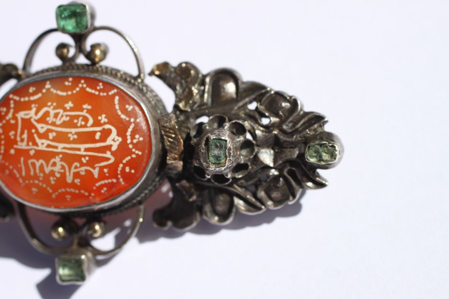 An Austro-Hungarian white metal brooch set with a central oval hardstone cabochon and six pale green - Image 7 of 12