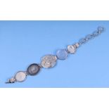 A sterling silver and glass cameo panel bracelet, the panels decorated in relief with Medusa,