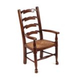 A North Country style child's ladderback chair with rush seat.