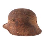 A WWII German helmet (battlefield pick up condition).