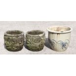 A pair of reconstituted stone circular planters, each 30cms diameter; together with a glazed pot,