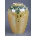 A Ruskin pottery vase decorated with grape and vine, on a yellow ground, 15cms high.Condition