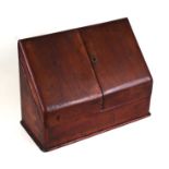 A Victorian walnut desk top stationery box, the two doors opening to reveal a fitted interior, 39cms