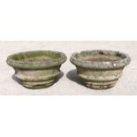 A pair of well weathered reconstituted stone circular planters, each approx 60cms diameter (2).