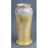 A Ruskin pottery vase decorated with trailing foliage on a yellow ground, 24cms high.Condition