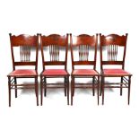 A set of four American spindle back chairs with upholstered seats (4).
