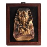 A painted plaster plaque depicting Tutankhamun's sarcophagus, 16 by 23cms.