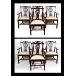 A matched set of eight Chippendale style mahogany carver dining chairs, each with pierced vase