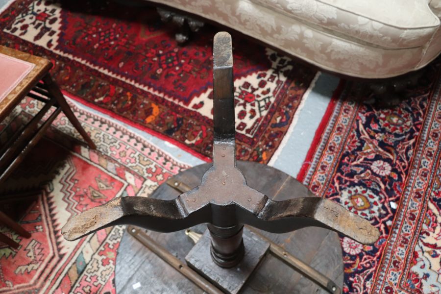 A 19th century oak tilt-top table on turned column and tripod base, 69cms diameter. - Image 2 of 5