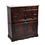 A 19th century Korean red pine and zelkova wood chest with rare sliding cupboard doors and an