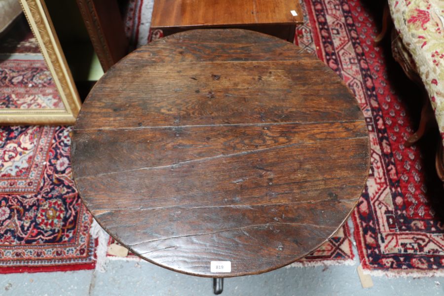 A 19th century oak tilt-top table on turned column and tripod base, 69cms diameter. - Image 4 of 5
