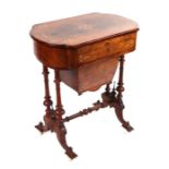 A Victorian walnut writing or work table with shaped rectangular top and inlaid decoration,