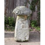 A well weathered staddle stone, 84cms high.