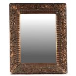 A gilt gesso wall mirror with rectangular plate, 46cms wide.