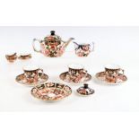 A small group of Royal Crown Derby Imari pattern tea wares to include teapot, cups & saucers and