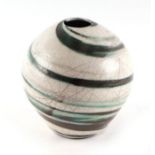 An Eeles Mosterton Dorset pottery pot of ovoid form with crackle glaze decoration, 12cms high.