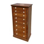 A late 19th century stained pine Wellington chest consisting of eight graduated long drawers, on a