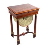 A 19th century Empire style rosewood sewing or work table, the rectangular lift-up lid revealing a