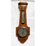 A John Barker & Co. of Kensington barometer thermometer in a walnut case, 55cms high.