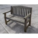 A garden bench. 123cm wide