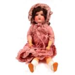 A bisque headed doll.Condition ReportThe back of the neck has some paint loss and scratches but