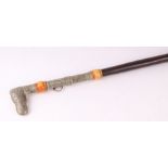 A Middle Eastern metal mounted hardwood sword stick, overall 100cms long, blade length 58cms.