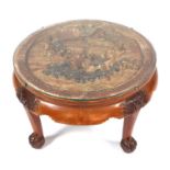 A Chinese carved hardwood coffee table, the top deeply carved with figures in a seascape, on lion