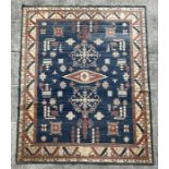 A Pakistan hand knotted rug with geometric Kazak design, 386 by 262cms.