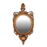 A gilt gesso wall mirror, overall 34 by 69cms.
