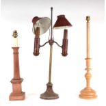 A continental toleware twin-arm table lamp; together with two wooden table lamps (3).