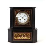 A French boulle cased mantle clock, the white enamel dial with Roman numerals, the movement striking