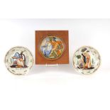 A maiolica plate decorated with a classical scene mounted in a wooden frame, plate 19cms diameter;